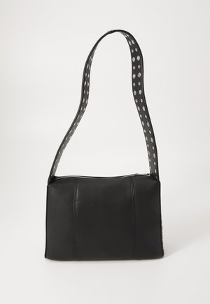 Black leather handbag with a rectangular shape, featuring a zip closure and a polka-dotted strap. Smooth texture, minimal stitching detail.