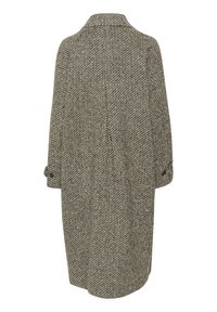 Cappotto in lana a principio houndstooth grigio e nero, con colletto, maniche lunghe e polsini con bottoni. La vista posteriore mostra una vestibilità rilassata.