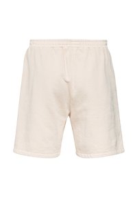 Beżowe spodenki z elastycznym pasem, o luźnym kroju i prostym wykończeniu, wykonane z miękkiej, fakturowanej tkaniny.