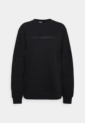 Schwarzer Langarm-Sweatshirt mit dem auf der Brust geprägten Schriftzug „KARL LAGERFELD“ sowie gerippten Bündchen und Saum.