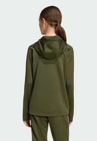 Olive green hoodie with a fitted design, soft texture, and a hood. Features set-in sleeves and a slightly curved hem. Suitable for active wear.