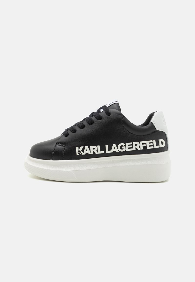 Black leather sneaker with thick white sole, featuring prominent "KARL LAGERFELD" logo on the side and white heel accents. Classic lace-up design.