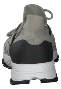 Gray sports shoe with a knitted upper material, black heel cap, white midsole, and textured black outsole. Features a pull tab for easy wear.