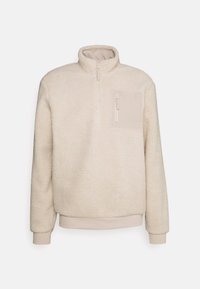 Sudadera de forro polar en beige claro, con un cuello alto, cierre de cremallera de un cuarto en la parte delantera y un pequeño bolsillo en el pecho con cremallera en beige a juego.