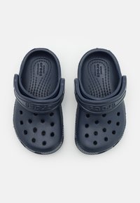 Navy blue Crocs with a ventilated design, thick strap, and perforations on top. Made of lightweight material with a textured surface.
