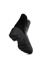 Black ankle boot with a suede upper and a textured rubber sole. Features a side zipper and a chunky heel for stability.