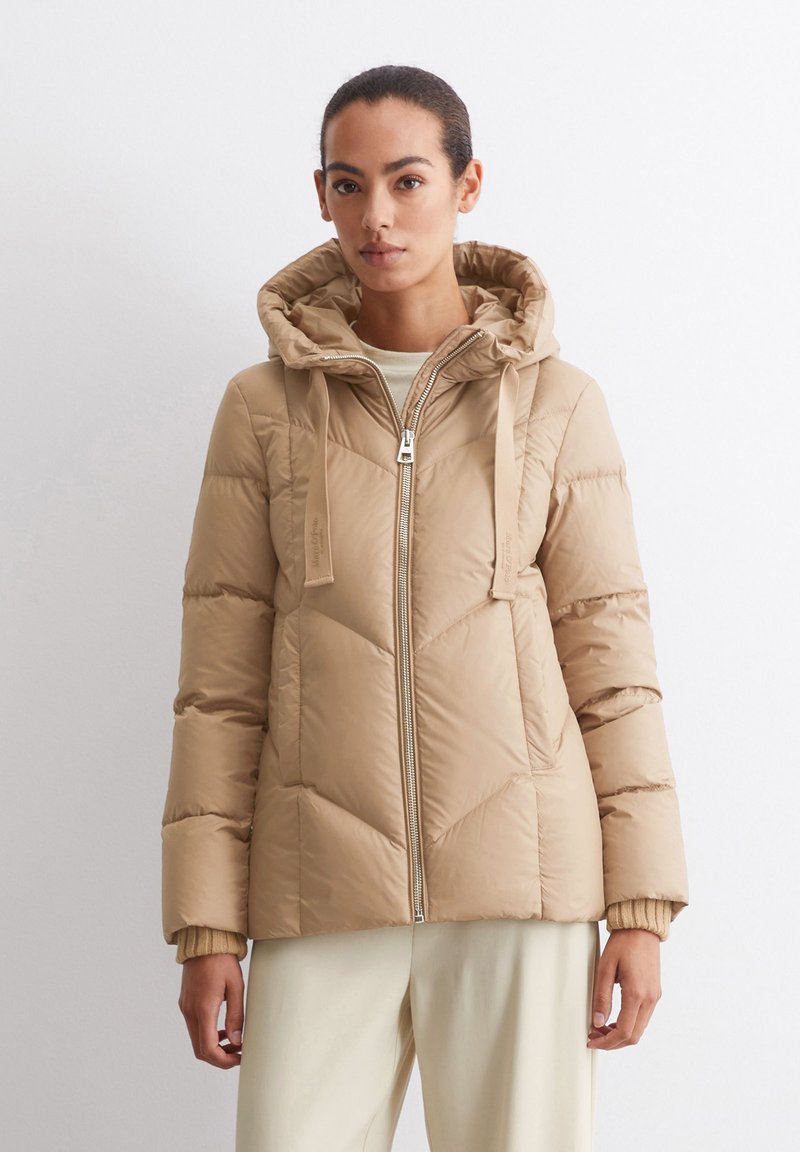 Tan, quilted puffer jacket with a hood. Features a front zipper, adjustable drawstring, and ribbed cuffs for a snug fit.