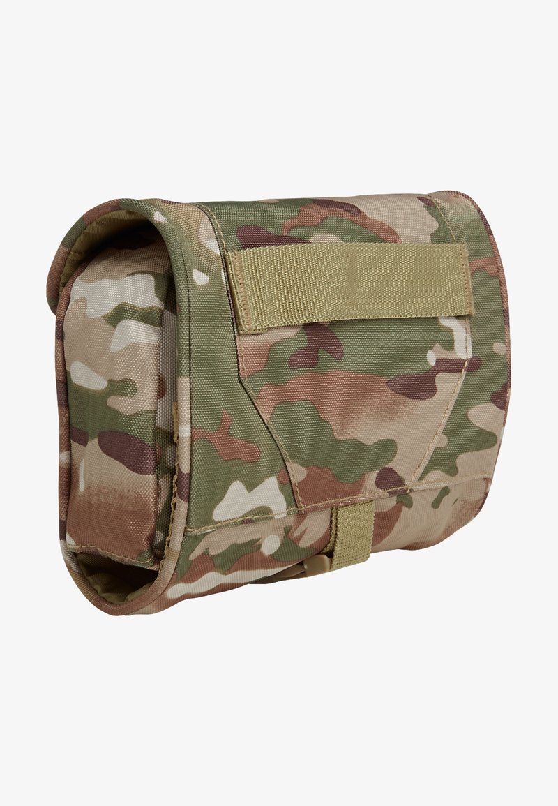 Kamuflasjepose laget av holdbart stoff med grønne, brune og beige mønstre. Har en borrelåsrem og solid konstruksjon.