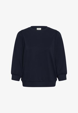 Blouse bleu marine à manches longues avec encolure ronde, épaules bouffantes et poignets ajustés.