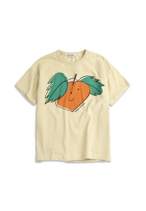 T-shirt beige clair à manches courtes avec un imprimé graphique d'un fruit orange souriant et deux grandes feuilles vertes à l'avant.