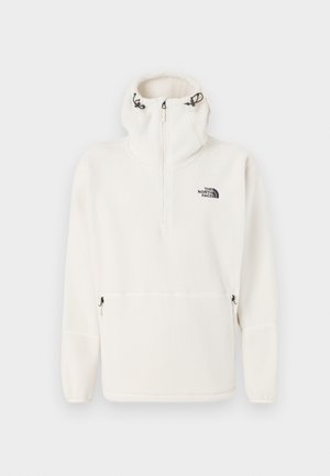 Felpa bianca in pile con zip a metà, con cordini regolabili sul cappuccio, tasche laterali con zip e logo The North Face sul petto.