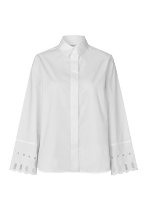 Witte blouse met lange mouwen en een knoopsluitende kraag, met geborduurde oogjesaccenten op de manchetten en een rechte zoom.