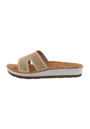 Sandale à glissière beige avec une large bride ornée de rangées de petits accents argentés, semelle intérieure texturée et semelle rembourrée blanche et brune.