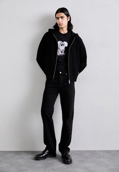 sandro STONEWASH - Relaxed fit jeans - noir