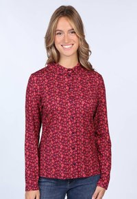 Long-sleeve, button-up shirt in dark red with floral patterns in pink, orange, and yellow. Features a pointed collar and soft fabric.