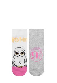 Calzini bianchi e grigi con un gufo dei cartoni animati e il testo "Harry Potter" su uno, e "Platform 9¾" in rosa sull'altro. Materiale morbido in misto cotone.