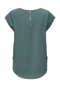 Kurzärmlige Bluse in gedämpftem Grün mit strukturiertem Stoff, rundem Saum, seitlichen Taschen und einem kurzen Reißverschluss im Nacken.