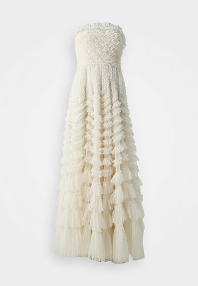 Strapless white dress with a textured bodice and layered ruffle skirt, featuring sheer tulle and a subtle dotted pattern throughout.