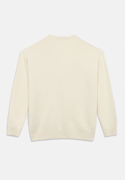Πουλόβερ σε κρεμ απόχρωση με στρογγυλή λαιμόκοψη, μακριά μανίκια και πλεκτές ριμπ μανσέτες και τελείωμα. Απαλή, λεία υφή χωρίς σχέδια ή διακοσμήσεις.