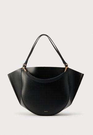 Black leather handbag with a unique rounded shape, featuring two slender straps and a gold hardware accent. Smooth texture and minimal branding.