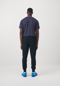 ICANIWILL ACTIVITY PANTS MEN - Treniņtērpa apakšdaļas - black