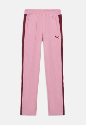 Pantalones deportivos rosas con una cinturilla acanalada, que presentan paneles laterales en marrón, bolsillos con cremallera y un pequeño logo en el muslo izquierdo.