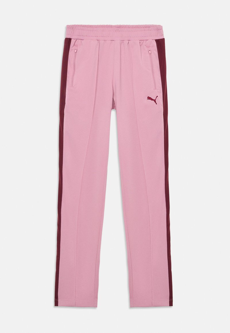Pantalones deportivos rosas con una cinturilla acanalada, que presentan paneles laterales en marrón, bolsillos con cremallera y un pequeño logo en el muslo izquierdo.