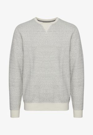 Világosszürke pulóver, amelyet texturált kötött minta, V nyakú dizájn, valamint bordázott mandzsetta és szegély jellemez, ezáltal kényelmes illeszkedést biztosít.