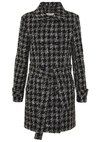 Svart och vit tweedkappa med dubbelknäppt design, stora knappar och bältad midja; har en klassisk krage och strukturerat mönster.