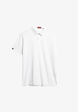 Witte polo met een kraag, korte mouwen en een rechte zoom. Gemaakt van zacht katoen, met een klein logo-accent op de mouw.