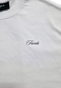 White cotton t-shirt featuring black embroidered text "Favela" on the front. Crew neck and short sleeves, smooth texture.
