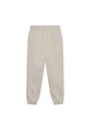 Pantaloni jogger beige chiaro con vita elastica, polsini affusolati e tasca sul retro. Realizzati in un tessuto morbido e liscio.