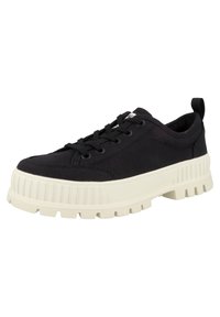 Black canvas sneakers with a thick cream sole, rounded toe, lace-up design, and textured ridges on the midsole. Features a pull tab.