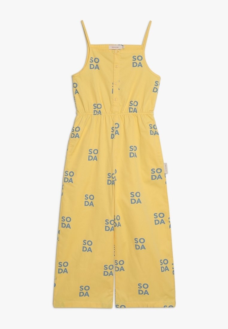 Combinaison jaune avec bretelles spaghetti réglables, boutonnée à l'avant, taille élastique, et motif répétitif bleu "SODA" sur l'ensemble.