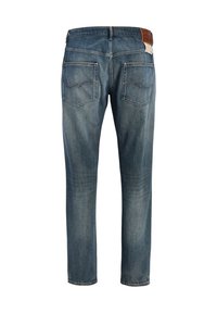 Τζιν παντελόνια σε ξεθωριασμένο μπλε χρώμα, με ίσια γραμμή, πίσω τσέπες με καμπυλωτό ράψιμο και καφέ δερμάτινη ετικέτα στη ζώνη μέσης.