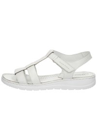 Bílé kožené sandály s několika popruhy, polstrovanou podrážkou a zadním popruhem pro podporu. Obsahují perforovanou stélku pro prodyšnost.