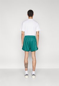 adidas Originals 80S SPRINT - Treniņtērpa apakšdaļas - collegiate green