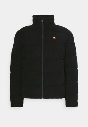 Black padded jacket with high collar, featuring a zip front and small multicolored logo on the chest. Textured fabric and structured fit.