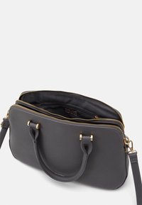 Gray leather handbag with gold zippers, dual handles, and a detachable strap. Interior features a black lining and organizational pockets.