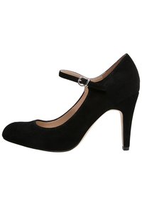 Ballerines Mary Jane en suède noir avec un embout arrondi, un dos fermé, une sangle ajustable et un talon stiletto de 3 pouces. Doublure intérieure lisse.