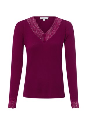 Diep roze geribd top met lange mouwen met kantafwerking op de V-hals en mouwboorden, klein strikdetail bij de hals.