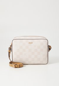 Cream and beige checkered crossbody bag with a structured shape, gold hardware, and an adjustable tan strap. Textured synthetic material.
