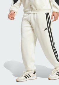 adidas Sportswear - Tracksuit bottoms - off white   black Thumbnail Image 1