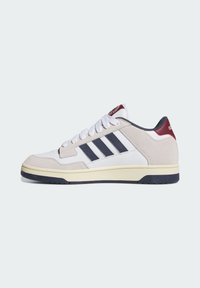 Sneakers featuring a beige suede and white leather upper, navy stripes, and a maroon heel tab. Rubber sole with a textured finish.