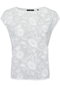 Blusa blanca de tela ligera, con bordado floral, mangas cortas, escote redondo y un ajuste holgado.
