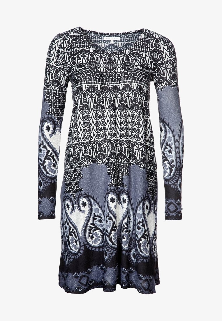 Long-sleeve dress featuring a black and white paisley and floral pattern on a blue background, made of soft stretch fabric with a relaxed fit.