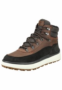 Scarponcino da trekking alto marrone e nero realizzato in materiali in pelle e tessuto, dotato di occhielli in metallo, lacci tondi e suola in gomma scanalata.