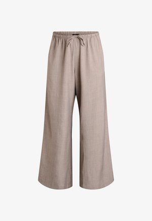 Beežid laia lõikega püksid kummipaela ja nööriga, valmistatud kerge tekstuuriga kangast.