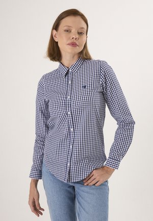 Camicia in cotone con bottoni, a motivi gingham blu navy e bianco, con colletto classico e maniche lunghe. Logo discreto sul petto.