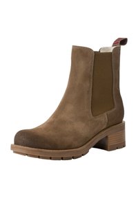 Bottine en daim marron avec des panneaux latéraux élastiques, bout arrondi et talon empilé. Présente un motif texturé et une languette à l'arrière.
